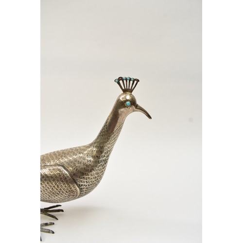 8035 - A Persian silver figure of a peacock, engraved feather detail, character marks to underside, 19.5cm ... 