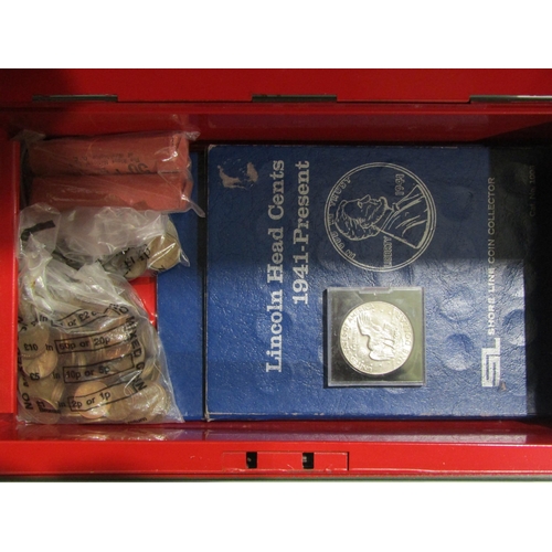 4390 - A cash box with key containing various World coinage including US unused 50c pennies