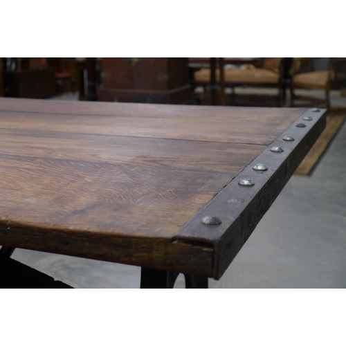 2010 - A large oak topped table on cast iron singer base, 178 x 87cm