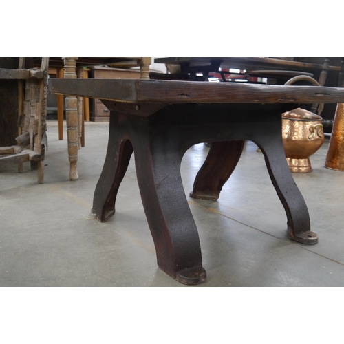 2016 - An oak topped table on industrial cast iron base, 81x61cm