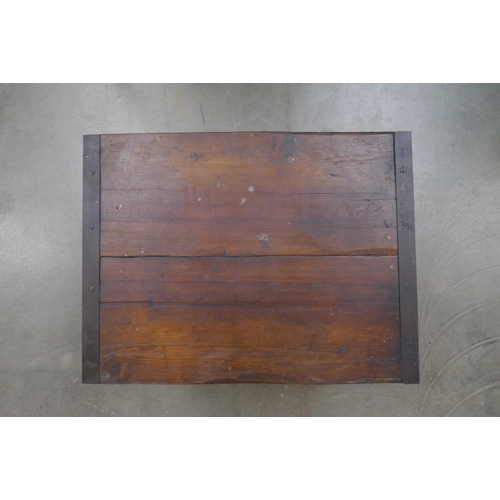 2016 - An oak topped table on industrial cast iron base, 81x61cm