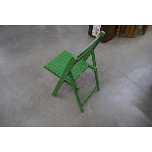 2023 - Three green painted beech folding chairs
