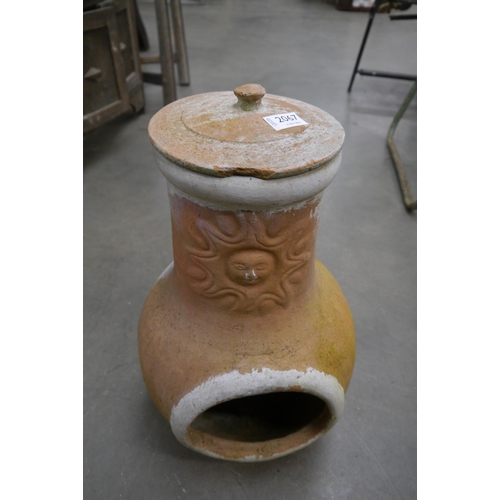 2067 - A small chimenea with sun motif and lid
