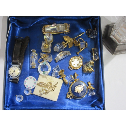 4428 - A glass vase with silver base together with a selection of miniature glass ornaments, gents wristwat... 