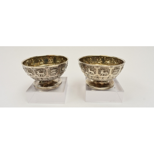 8015 - A pair of Victorian Hamilton & Inches, Edinburgh silver salts, decorated with signs of the zodiac an... 
