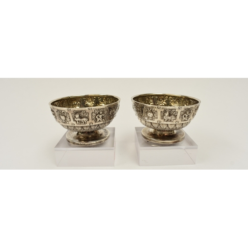 8015 - A pair of Victorian Hamilton & Inches, Edinburgh silver salts, decorated with signs of the zodiac an... 