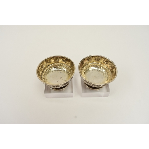 8015 - A pair of Victorian Hamilton & Inches, Edinburgh silver salts, decorated with signs of the zodiac an... 