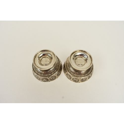 8015 - A pair of Victorian Hamilton & Inches, Edinburgh silver salts, decorated with signs of the zodiac an... 