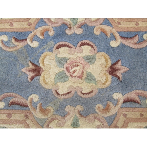1098 - A Chinese blue ground fringed rug, 130cm x 62cm