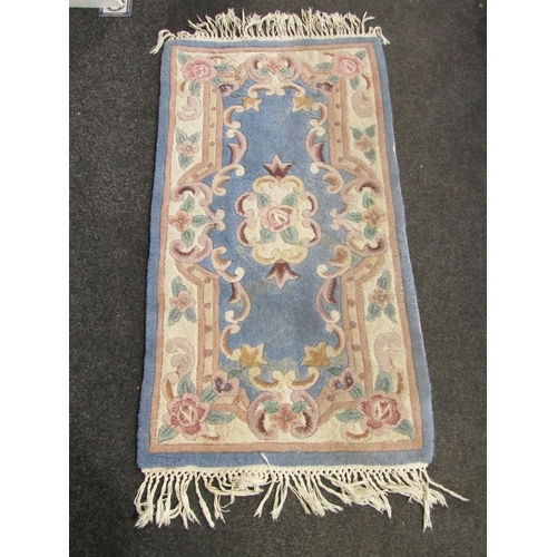 1098 - A Chinese blue ground fringed rug, 130cm x 62cm