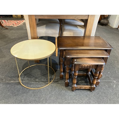 1108 - A nest of three Ercol style graduating occasional tables, 48cm tall x 60cm long x 38cm wide. A brass... 