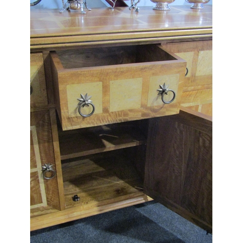 1007 - A Flagstone Furniture mango wood sideboard with stone inlay, three drawers over three cupboard doors... 