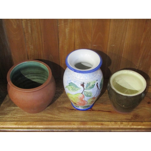 1012 - A terracotta jardinière with green glaze interior, stoneware egg crock and ceramic vase with pear an... 