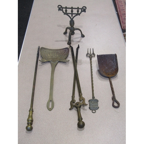 1018 - A brass coal scuttle with various fireside tools