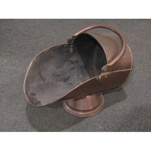 1046 - Two copper coal scuttles and an Aspen brass fire fret (3)