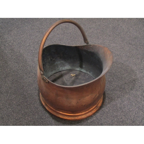1046 - Two copper coal scuttles and an Aspen brass fire fret (3)