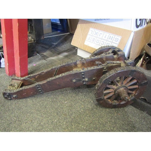 1056 - A painted magazine trough, a stand for a model cannon, wrought iron candelabra and a scratch built c... 