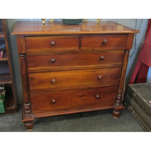 1074 - Two similar 20th Century hardwood two short over three chests of drawers flanked by turned spindles,... 