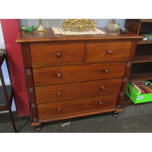 1074 - Two similar 20th Century hardwood two short over three chests of drawers flanked by turned spindles,... 