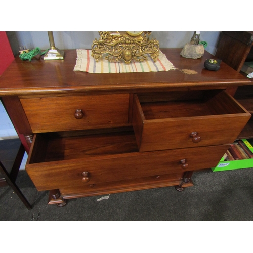 1074 - Two similar 20th Century hardwood two short over three chests of drawers flanked by turned spindles,... 