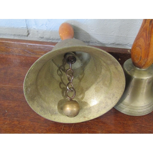 1076 - Five hand bells of various sizes, wooden handles