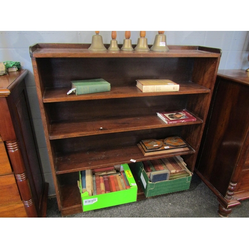 1083 - A 20th Century oak four shelved bookcase, 117cm tall x 108cm wide x 25cm deep