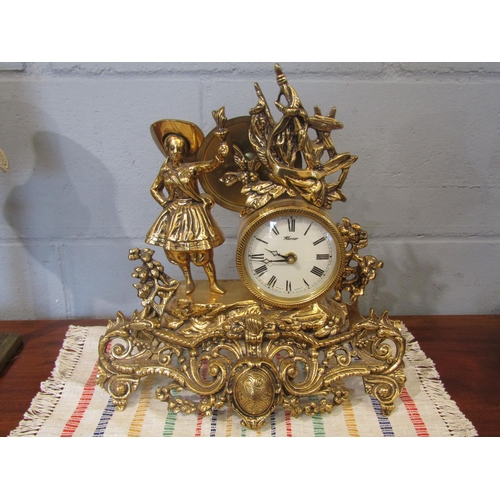1086 - A Mozer brass mantel clock with a woman holding a flame, battery operated