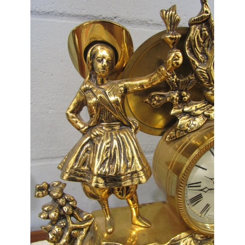 1086 - A Mozer brass mantel clock with a woman holding a flame, battery operated