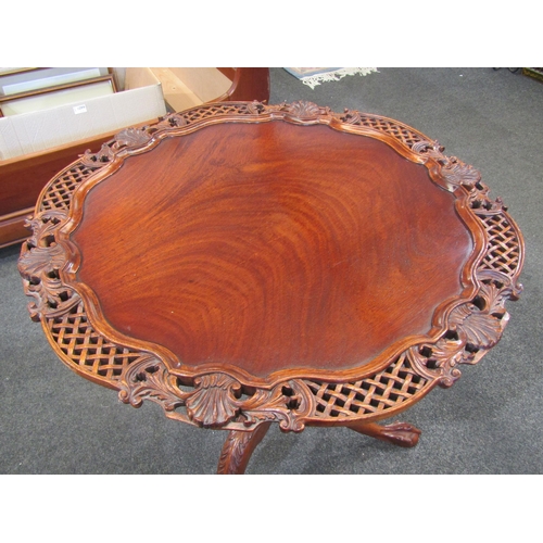 1106 - A mahogany tilt-top pivoting tripod table with bird cage mechanism, acanthus leaf carving to legs, b... 