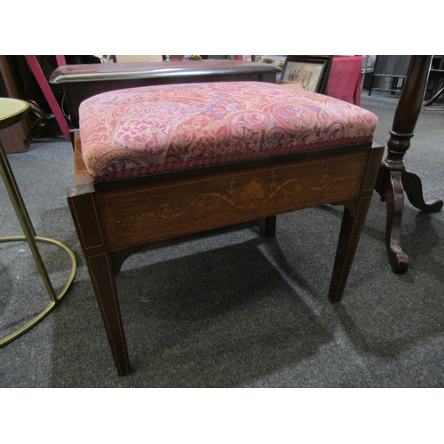 1110 - A 20th Century stool with rising lid, upholstered in floral fabric, satin wood inlay