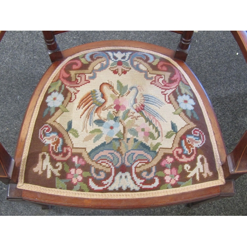 1114 - An Edwardian inlaid mahogany lady's armchair with carved acanthus detail to back rail and arms, tape... 