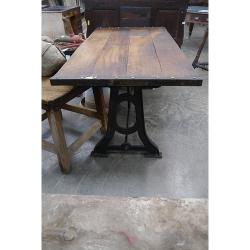 2003 - A large oak topped table on cast iron singer base, 178 x 87cm