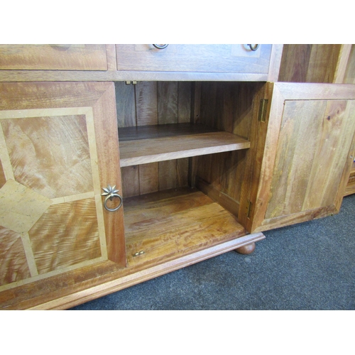1013 - A Flagstone Furniture mango wood glazed display cabinet with stone inlay, two glazed doors and two d... 