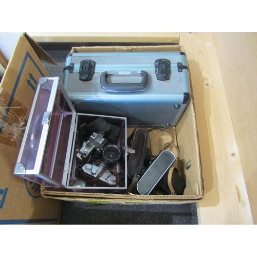 1104 - A box of camera equipment including Minolta SRT 101b, Halina 35X, Zenit-E Zorki 4 and a Panasonic NV... 
