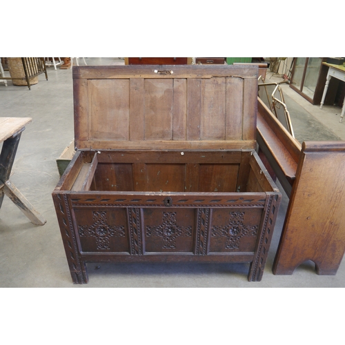 2001 - An 18th Century carved oak panelled coffer, 122cm