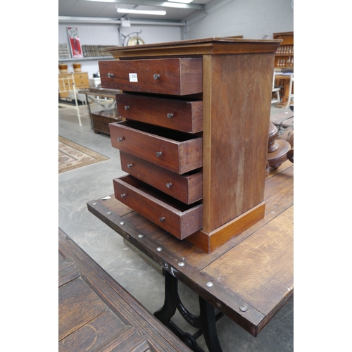 2002 - A Edwardian mahogany table top five drawer chest of drawers, plinth base