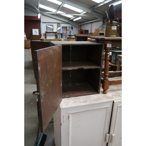 2035 - An Edwardian oak single door table top cupboard