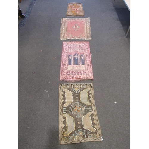 1120 - Four Eastern wool rugs, largest 100cm x 78cm, possibly prayer rugs, worn