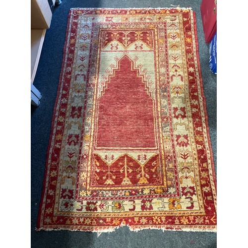 1180 - Two Eastern wool rugs, one red ground, red, navy and green motif borders, 140cm x 68cm, the other or... 