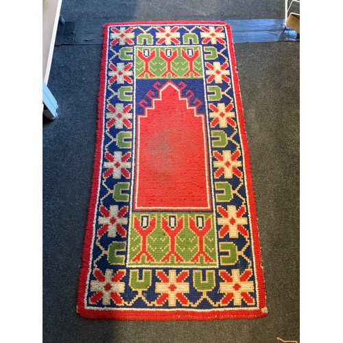 1180 - Two Eastern wool rugs, one red ground, red, navy and green motif borders, 140cm x 68cm, the other or... 