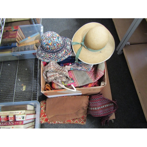 1440 - A collection of early 20th Century linen together with colourful textiles and hats