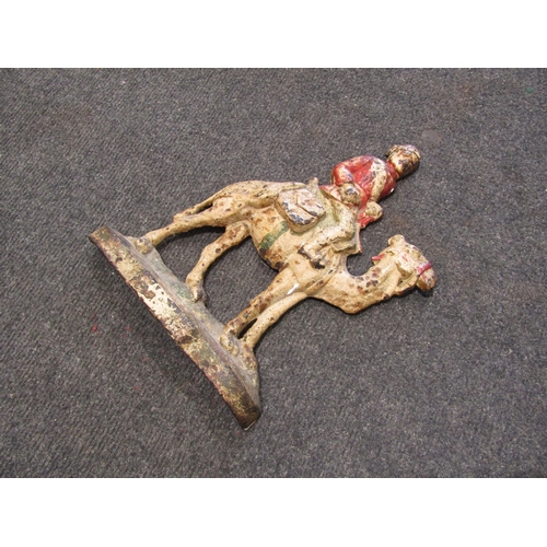 1490 - A cast iron doorstop as Lord Kitchener on camel, 30cm tall
