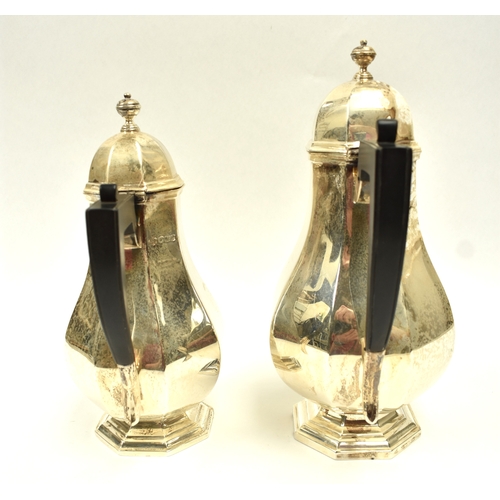 8008 - 18th Century style silver coffee pot of pedestal panelled baluster form, with domed lid and ebonised... 