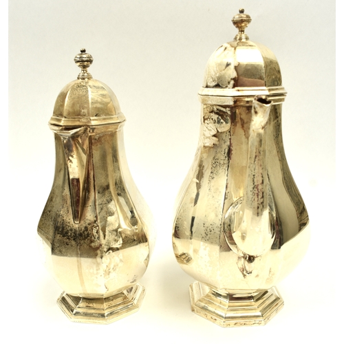 8008 - 18th Century style silver coffee pot of pedestal panelled baluster form, with domed lid and ebonised... 