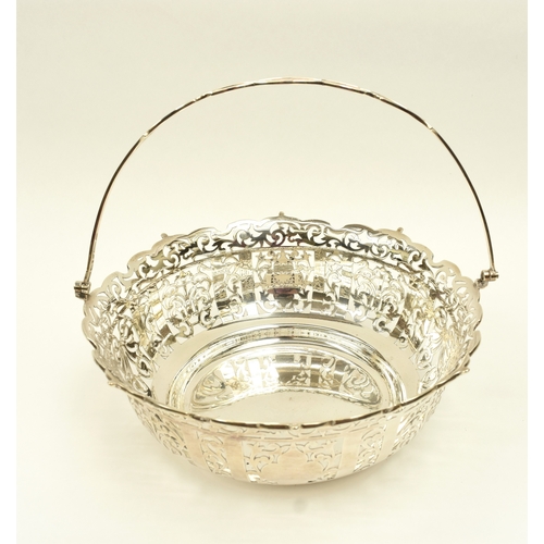 8005 - R Ltd large silver pierced basket with swing handle, London 1910, 21.5cm tall, 25.3cm diameter, 671g