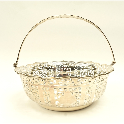 8005 - R Ltd large silver pierced basket with swing handle, London 1910, 21.5cm tall, 25.3cm diameter, 671g