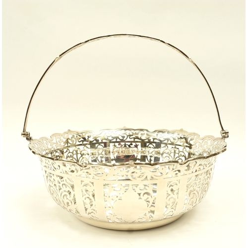 8005 - R Ltd large silver pierced basket with swing handle, London 1910, 21.5cm tall, 25.3cm diameter, 671g
