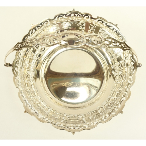 8005 - R Ltd large silver pierced basket with swing handle, London 1910, 21.5cm tall, 25.3cm diameter, 671g