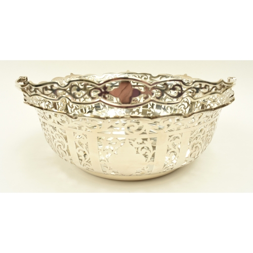 8005 - R Ltd large silver pierced basket with swing handle, London 1910, 21.5cm tall, 25.3cm diameter, 671g