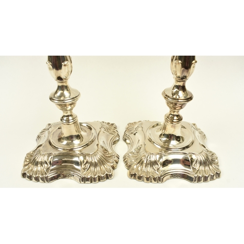 8002 - A pair of William Hutton & Sons Ltd large silver weighted based candlesticks of classic design, Lond... 